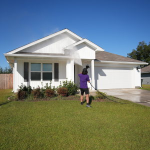 Guy pressure washing house. pensacola fl pressure washing